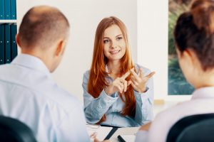 Confident young woman pointing her advantages during the recruitment interview